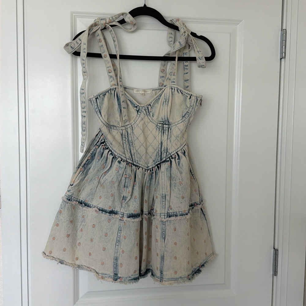 Loveshackfancy acid denim dress with polka dots and pockets